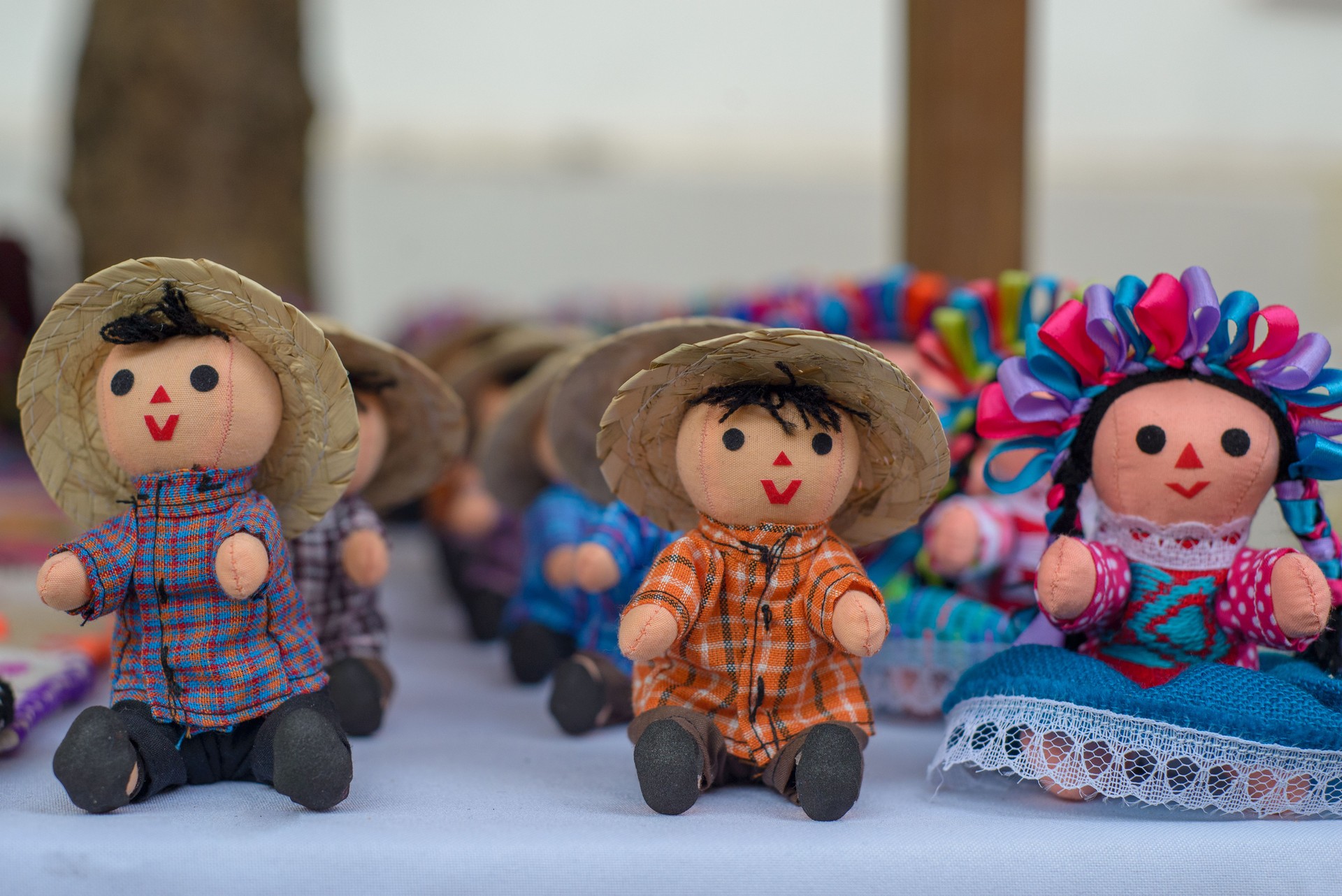 Small rag mexican doll in a street store. Mexican handicraft.